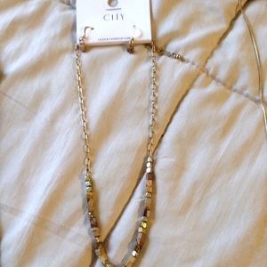 Two sitting necklaces with earrings to go